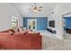 Spacious living room with vaulted ceilings, comfortable seating, and access to outdoor space at 7616 Derrek Pl, Indianapolis, IN 46219