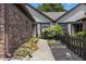 Landscaped walkway featuring lovely plants that lead to a charming home at 7616 Derrek Pl, Indianapolis, IN 46219