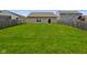 The backyard is fenced, providing lots of space at 7715 Bolero Dr, Camby, IN 46113