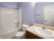 Bathroom with single sink, bathtub/shower combo, and tiled floor at 7715 Bolero Dr, Camby, IN 46113