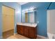 Bathroom featuring double sinks, spacious vanity, and a walk-in closet at 7715 Bolero Dr, Camby, IN 46113