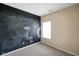 Bedroom with a chalkboard wall and window providing natural light at 7715 Bolero Dr, Camby, IN 46113
