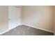 Bedroom with neutral carpet and paint, closet with sliding doors at 7715 Bolero Dr, Camby, IN 46113