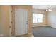The front entrance showcases the light-filled area leading into other rooms at 7715 Bolero Dr, Camby, IN 46113