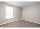 This is a bedroom with carpeted floors, neutral walls, and a window at 779 Alvey Ct, Greenwood, IN 46143