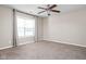 Spacious bedroom featuring neutral walls, carpet flooring, a ceiling fan, and a window at 779 Alvey Ct, Greenwood, IN 46143