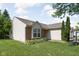 Charming single-story home featuring neutral siding, brick accents and a well manicured front lawn at 779 Alvey Ct, Greenwood, IN 46143