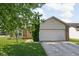 Charming single-story home featuring a two-car garage, front yard and brick accents at 779 Alvey Ct, Greenwood, IN 46143