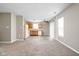 Open kitchen area with wood cabinets, white appliances, vinyl flooring and sliding doors to the exterior at 779 Alvey Ct, Greenwood, IN 46143
