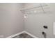 Laundry room with gray walls and a metal shelf at 779 Alvey Ct, Greenwood, IN 46143