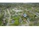 Aerial view of a home in a charming neighborhood with a pond, emphasizing its serene setting and convenient location at 8306 Corkwood Dr, Indianapolis, IN 46227
