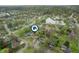 Aerial view of a residential area with a pond, highlighting the home's location in a Gathering-friendly neighborhood at 8306 Corkwood Dr, Indianapolis, IN 46227