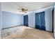 Bedroom with ceiling fan, curtains, rug, and neutral carpet at 8306 Corkwood Dr, Indianapolis, IN 46227