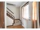 Inviting entryway featuring a staircase, wood accents, and a front door with natural light at 8306 Corkwood Dr, Indianapolis, IN 46227