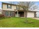 Two-story home with front lawn and attached garage at 8306 Corkwood Dr, Indianapolis, IN 46227