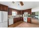 Well-equipped kitchen with stainless steel appliances, granite countertops, and wooden cabinets at 8306 Corkwood Dr, Indianapolis, IN 46227