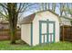 Painted outdoor shed on a level lot with mature trees at 8306 Corkwood Dr, Indianapolis, IN 46227