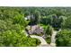 Stunning aerial view of a beautiful home surrounded by lush greenery and a landscaped yard at 8651 Emerald Ln, Indianapolis, IN 46260