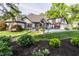 Spacious backyard with a swimming pool, lush landscaping, and well-manicured lawn, perfect for outdoor living at 8651 Emerald Ln, Indianapolis, IN 46260