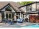 Inviting backyard patio with elegant outdoor furniture, BBQ, and a refreshing swimming pool, perfect for relaxation at 8651 Emerald Ln, Indianapolis, IN 46260