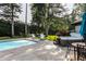 Beautiful backyard with a swimming pool, hot tub, and ample seating, perfect for outdoor entertainment and relaxation at 8651 Emerald Ln, Indianapolis, IN 46260