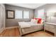 Cozy bedroom with ample natural light, hardwood floors, and stylish decor at 8651 Emerald Ln, Indianapolis, IN 46260