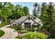 Stunning home with manicured landscaping, stone accents, shingle siding and inviting walkway at 8651 Emerald Ln, Indianapolis, IN 46260