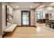 Spacious foyer with hardwood floors, modern art, and an open view to the living spaces at 8651 Emerald Ln, Indianapolis, IN 46260