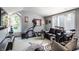 Spacious home gym with exercise equipment, comfortable seating, and large windows at 8651 Emerald Ln, Indianapolis, IN 46260