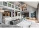 Spacious living room with soaring ceilings, elegant decor, and a view of the upper level at 8651 Emerald Ln, Indianapolis, IN 46260