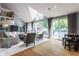 Bright and airy living room with vaulted ceilings, large windows, and access to the backyard at 8651 Emerald Ln, Indianapolis, IN 46260