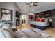 Spacious main bedroom with a fireplace, built-in bookshelves, and ensuite bathroom access at 8651 Emerald Ln, Indianapolis, IN 46260