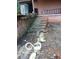 Image shows a concrete foundation and weathered staircase next to the home at 8803 S Sleepy Hollow Rd, Waldron, IN 46182