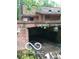 Attached garage with debris, damaged structure, and home exterior at 8803 S Sleepy Hollow Rd, Waldron, IN 46182