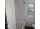 This bathroom features a shower and tub combo with a window, providing natural light at 9024 W Mooresville Rd, Indianapolis, IN 46113