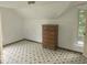 Bedroom featuring a dresser and patterned flooring at 9024 W Mooresville Rd, Indianapolis, IN 46113