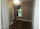 Bedroom with a window, neutral walls, and wood laminate flooring at 9024 W Mooresville Rd, Indianapolis, IN 46113