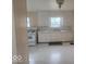 Kitchen features white cabinets, ample counter space, and practical appliances for everyday living at 9024 W Mooresville Rd, Indianapolis, IN 46113