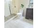 Modern bathroom with a glass-enclosed shower, tiled walls, and sleek vanity at 907 Corey Ln, Plainfield, IN 46168