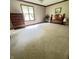 Spacious bedroom with neutral carpet, natural light, and traditional furnishings at 907 Corey Ln, Plainfield, IN 46168
