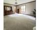 Spacious bedroom with neutral carpet, natural light, and traditional furnishings at 907 Corey Ln, Plainfield, IN 46168