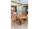 Charming dining area featuring a round wooden table with chairs, hutch, and stainless steel refrigerator at 907 Corey Ln, Plainfield, IN 46168