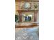 Close-up of a brick fireplace with wooden mantle and decor in a cozy living room at 907 Corey Ln, Plainfield, IN 46168