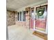 Inviting front porch with a red front door, brick accents, and a 'Welcome' mat at 907 Corey Ln, Plainfield, IN 46168