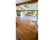 Spacious living room with a brick fireplace, hardwood floors, and comfortable seating area at 907 Corey Ln, Plainfield, IN 46168