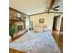 Cozy living room features a brick fireplace, hardwood floors, and comfortable seating at 907 Corey Ln, Plainfield, IN 46168