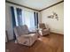 Comfortable living room featuring hardwood floors, two plush recliners, and a decorative wall accent at 907 Corey Ln, Plainfield, IN 46168