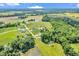Expansive aerial view of real estate development featuring homes, ponds, and natural landscapes at 9231 E Poynter Dr, Morgantown, IN 46160