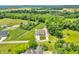 Aerial view showcasing a home nestled among lush greenery and surrounded by mature trees at 9231 E Poynter Dr, Morgantown, IN 46160