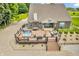 Spacious deck with a hot tub, outdoor seating, and a dining area for entertaining guests at 9231 E Poynter Dr, Morgantown, IN 46160
